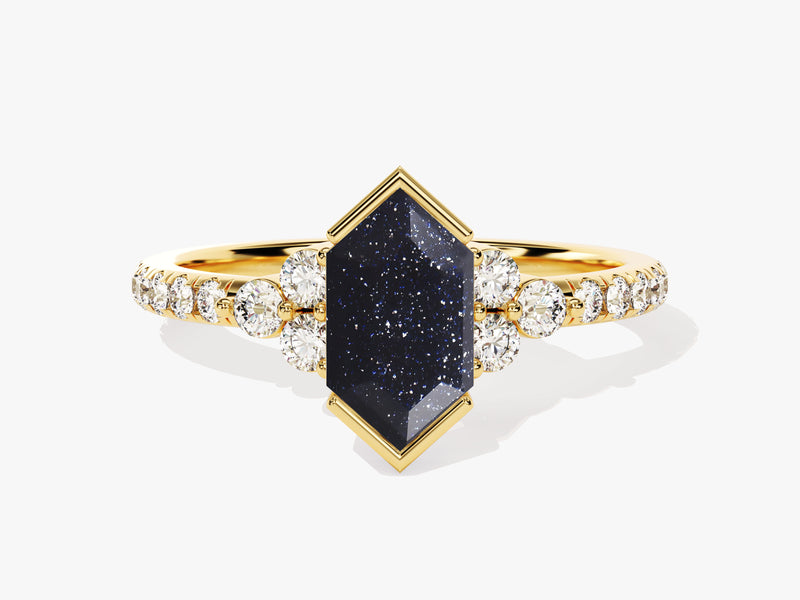 Gold ring with dark blue gemstone and diamonds