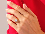 Gold ring with pear-shaped moonstone and diamond halo, jewelry