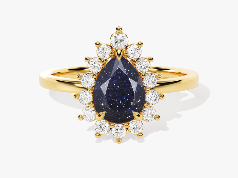 Gold ring with pear-shaped blue sandstone and diamond halo