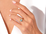 Jewelry: Gold ring with blue moss agate and diamonds on hand