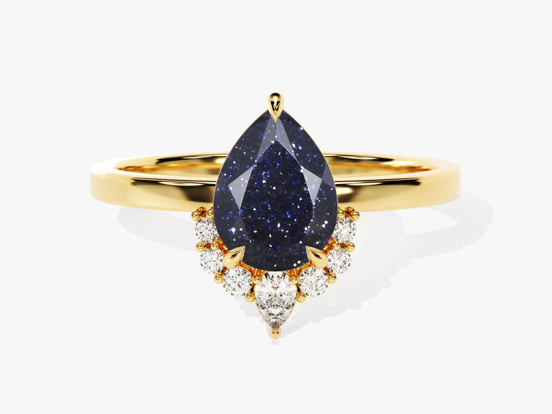 Gold ring with pear-shaped blue sandstone and diamond accents