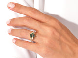 Gold ring with moss agate and diamonds on hand