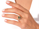 Moss agate hexagon ring with diamonds on a hand