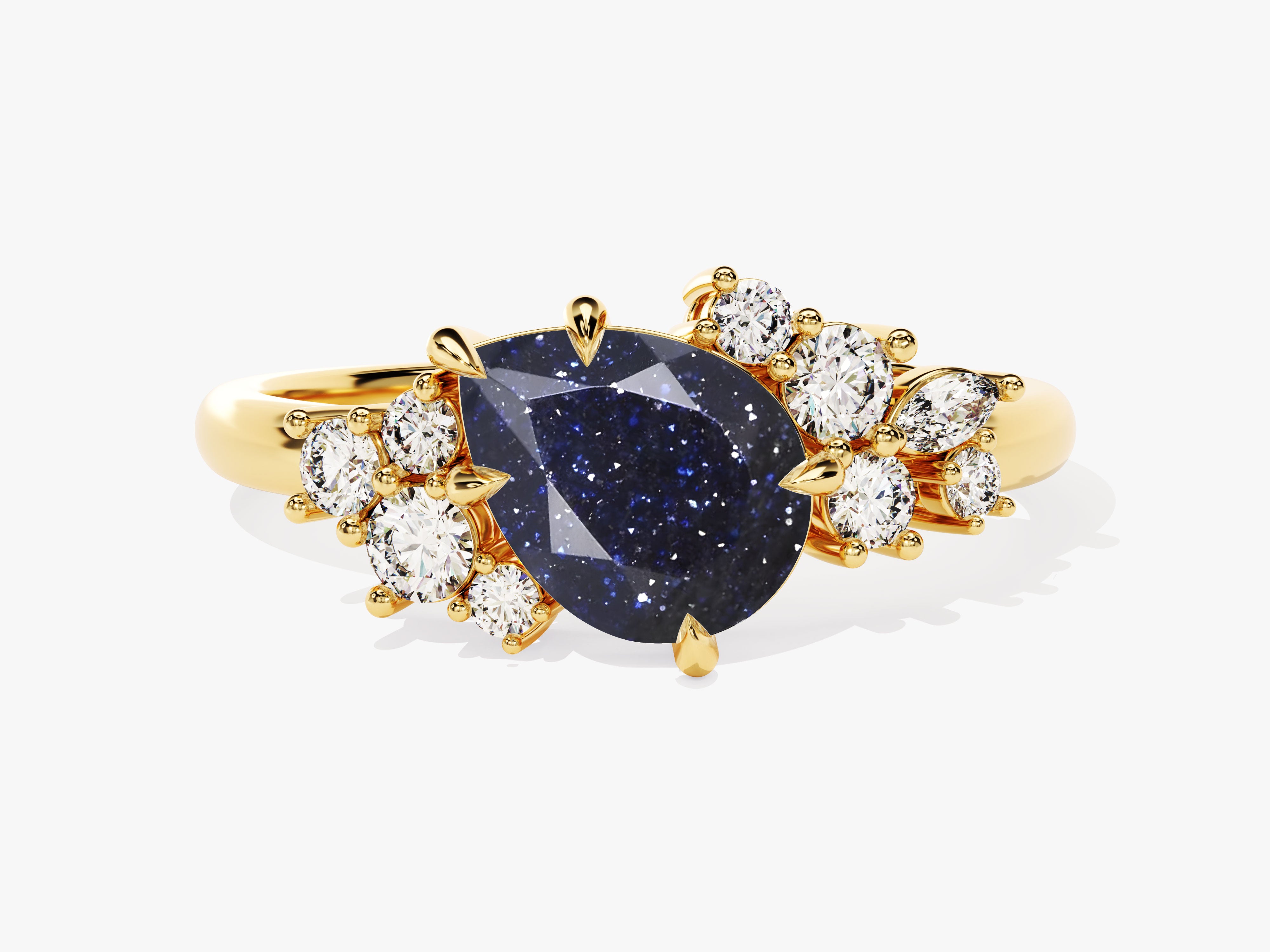 Gold ring with pear-shaped blue stone and diamonds