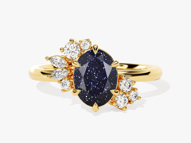 Gold ring with oval blue sandstone and diamonds