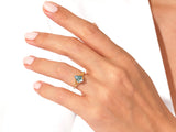 Gold ring with blue moss agate gemstone and diamonds on hand
