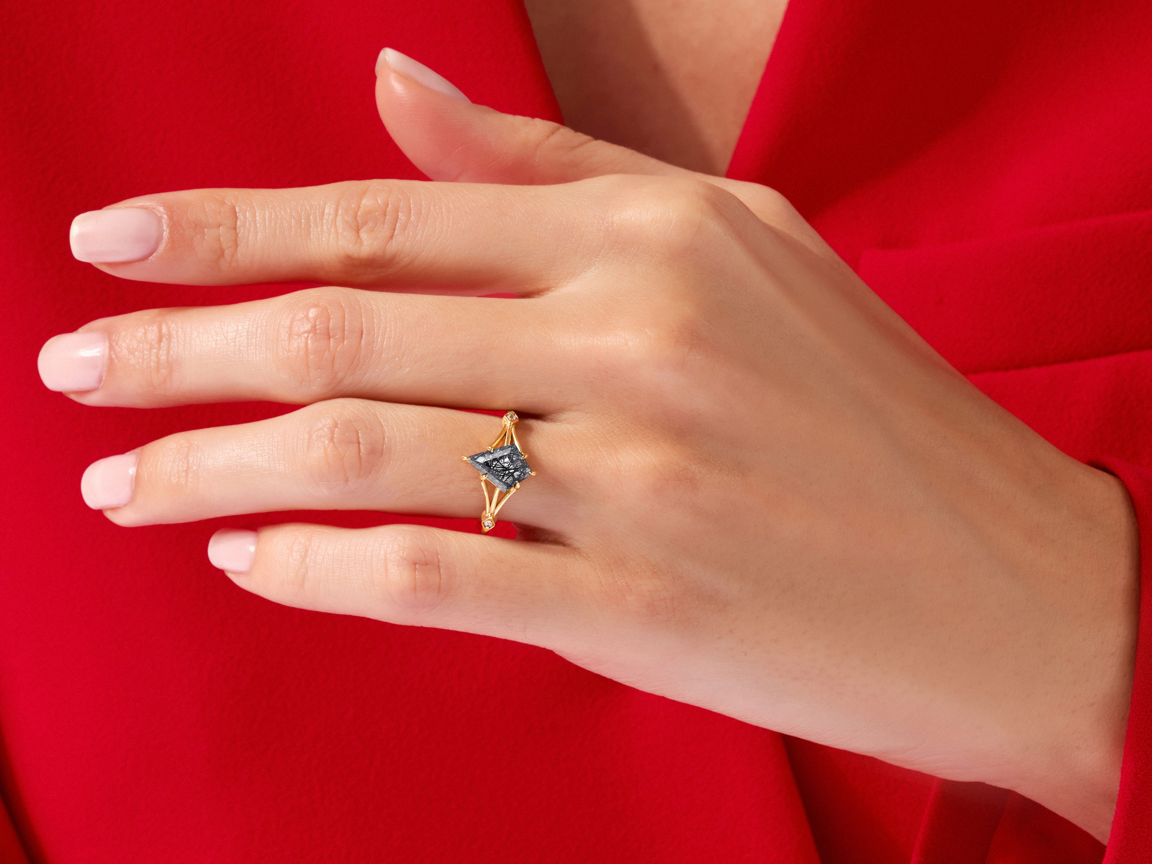 Gold ring with black diamond on hand, jewelry product