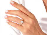 Gold opal diamond ring on a woman's hand