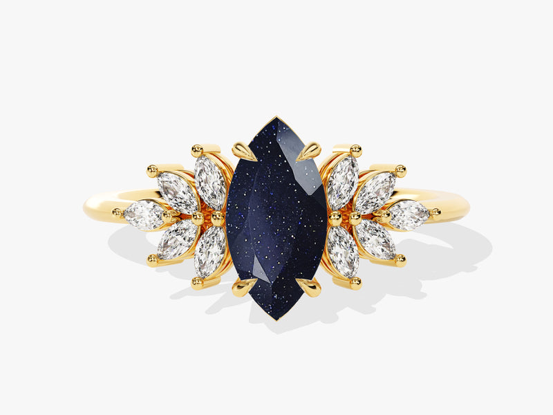 Gold ring with marquise diamonds and dark blue gemstone