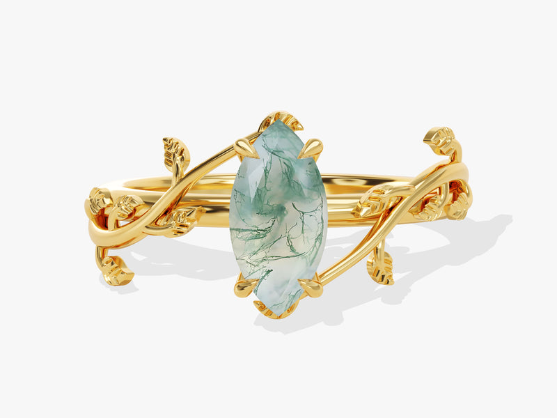 Gold ring with marquise moss agate gemstone and leaf design