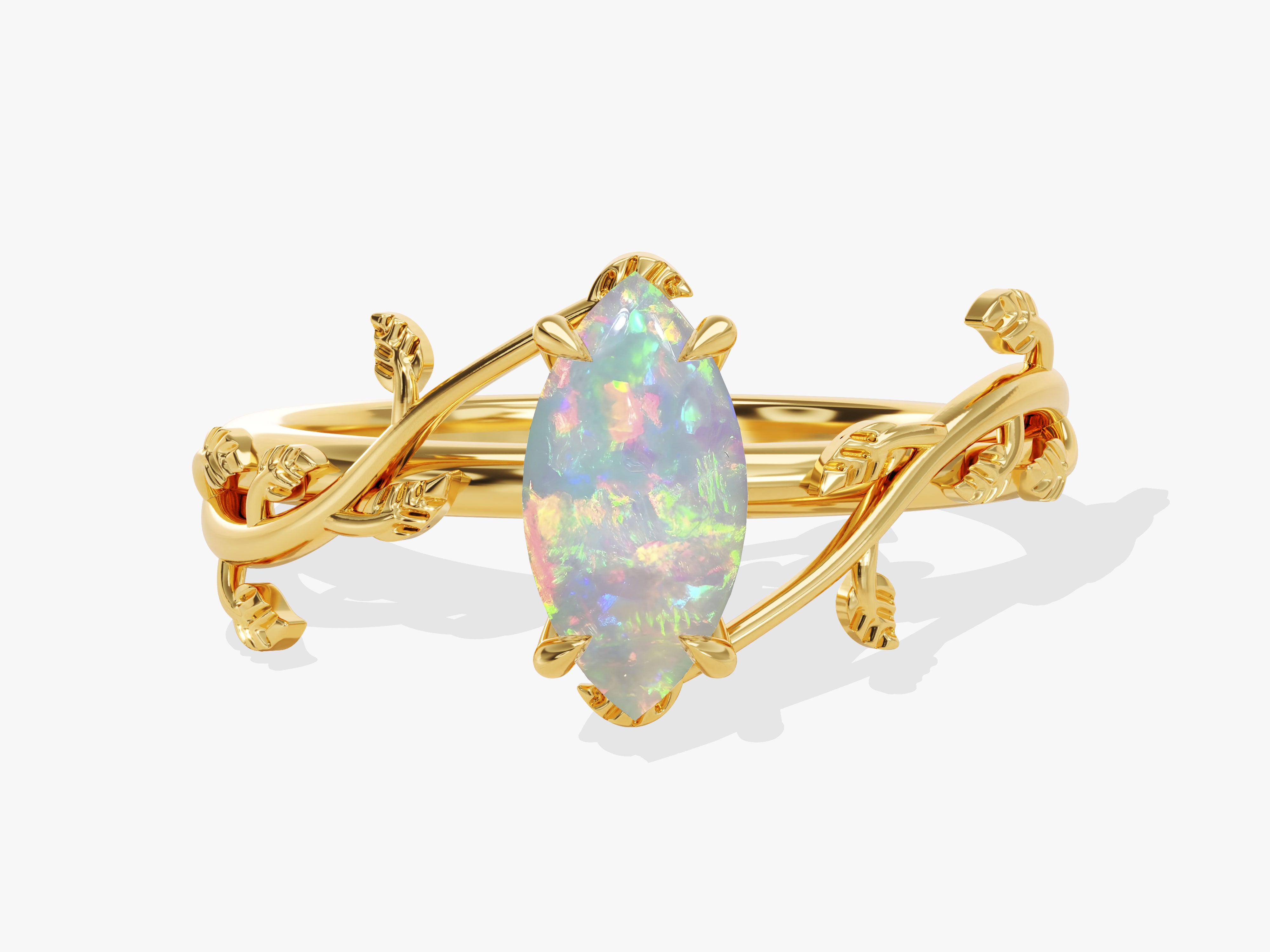 Gold ring with marquise opal and leaf design
