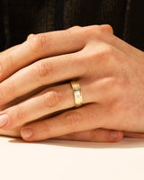 Gold ring with diamonds on a man's finger, jewelry