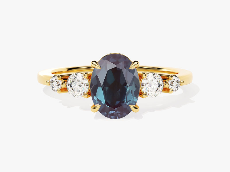Oval alexandrite and diamond engagement ring in gold