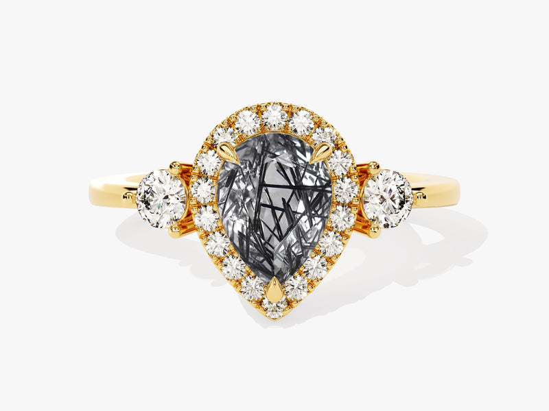 Gold ring with pear-cut rutilated quartz and diamond halo