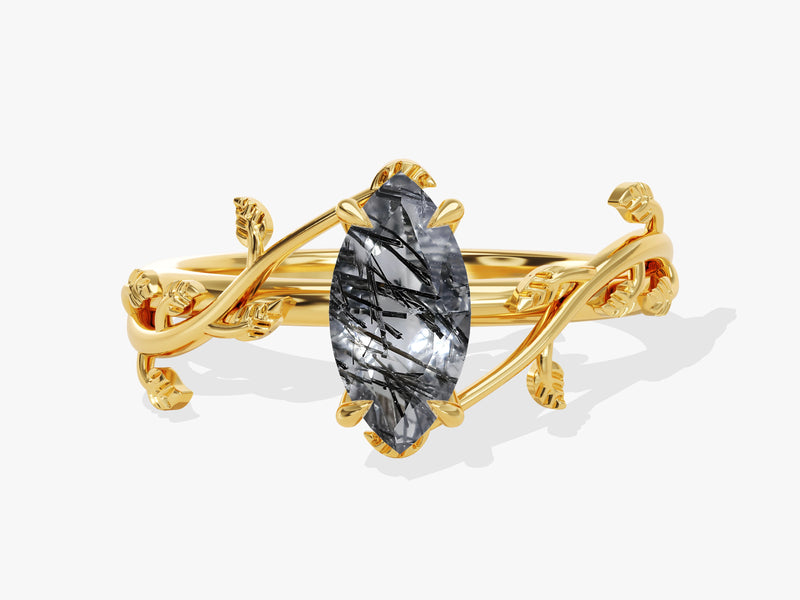 Gold ring with marquise cut rutilated quartz and leaf design